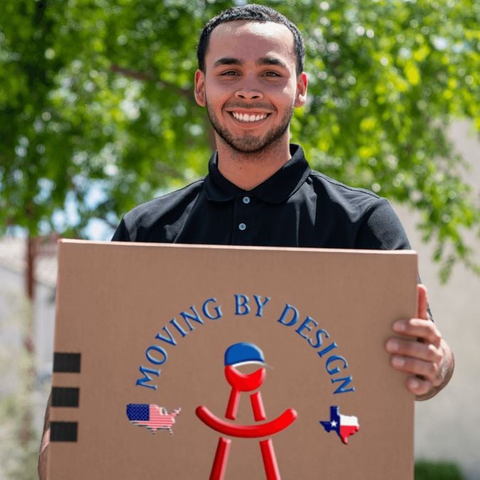 a member of Moving By Design holding a box