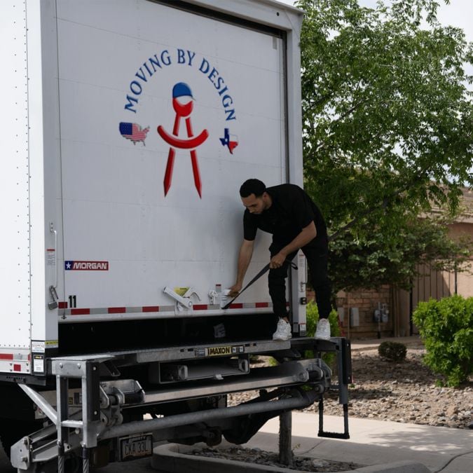 Moving By Design member opening a truck